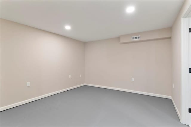 unfurnished room with concrete floors