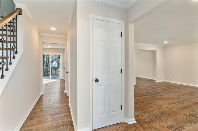 hall featuring crown molding and hardwood / wood-style floors