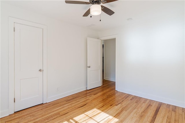 spare room with ceiling fan and light hardwood / wood-style floors