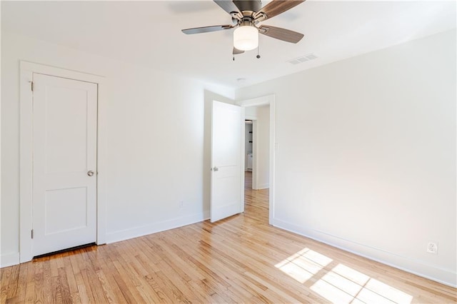 unfurnished bedroom with ceiling fan and light wood-type flooring