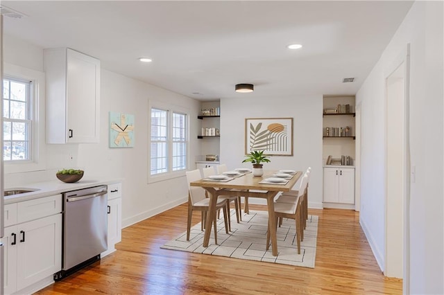 dining area with light hardwood / wood-style flooring