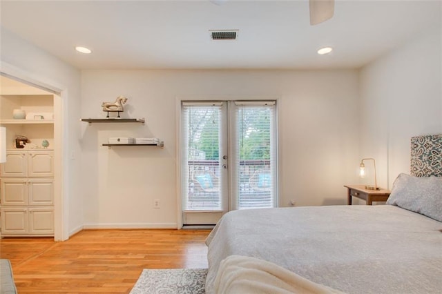 bedroom with access to exterior, french doors, and light hardwood / wood-style flooring