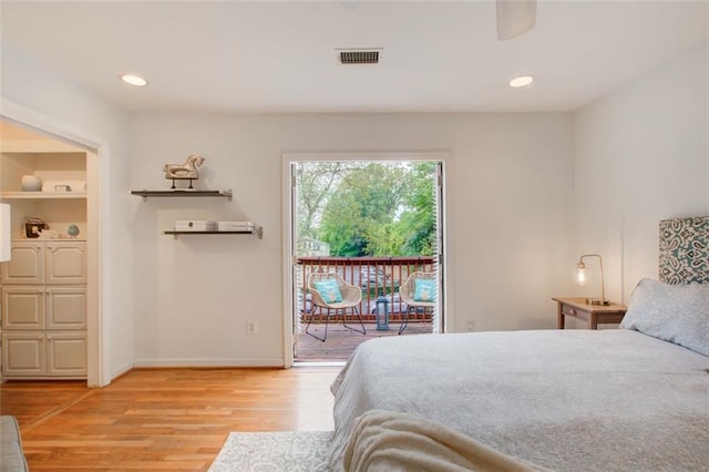 bedroom with light hardwood / wood-style floors and access to outside