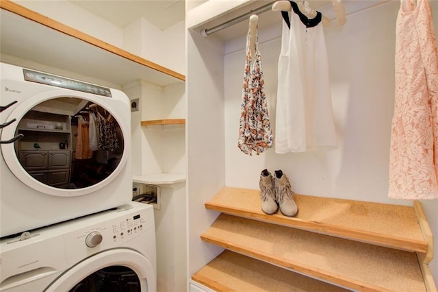 laundry room featuring stacked washer / dryer