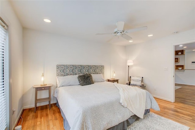 bedroom featuring ceiling fan and light hardwood / wood-style floors