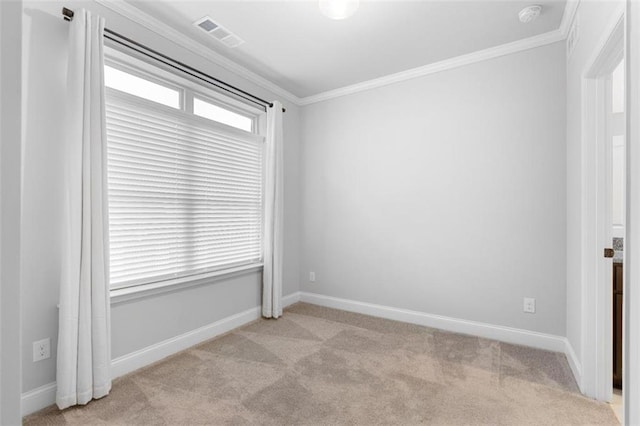 carpeted empty room featuring ornamental molding