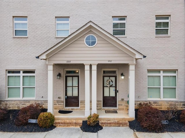 property entrance with covered porch