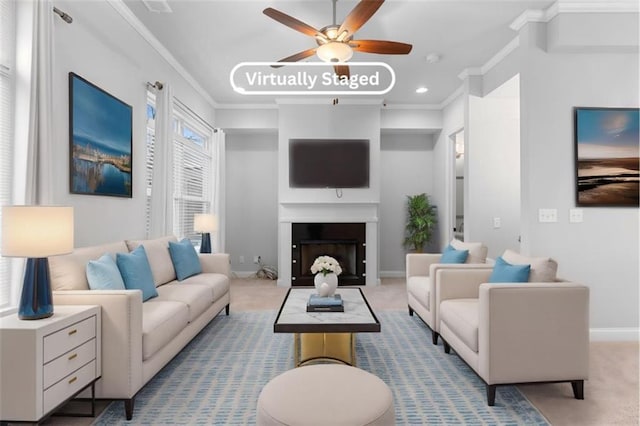 living room featuring light carpet, ornamental molding, and ceiling fan