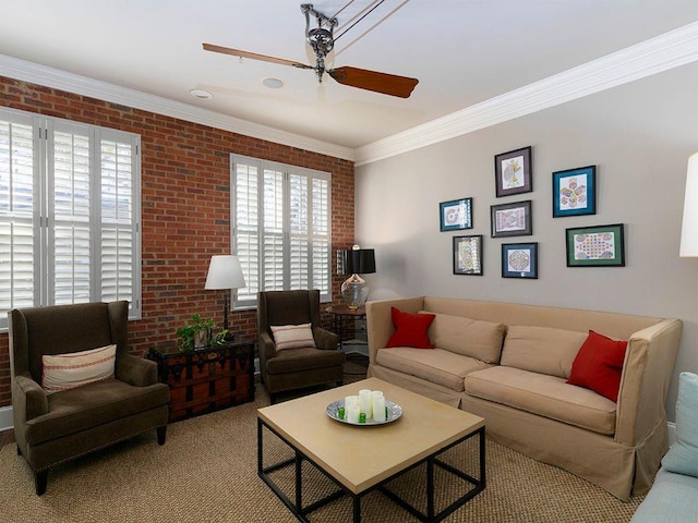 carpeted living room with ornamental molding, ceiling fan, and brick wall