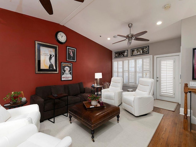 living room featuring lofted ceiling with beams, ceiling fan, wood finished floors, and recessed lighting