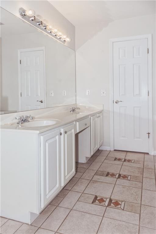 bathroom featuring double vanity and tile patterned flooring