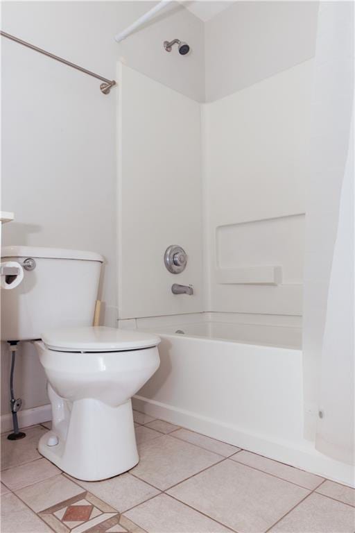 bathroom with tile patterned floors, toilet, and shower / bath combination