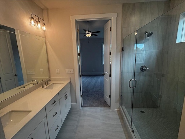 bathroom with ceiling fan, vanity, tile patterned floors, and an enclosed shower