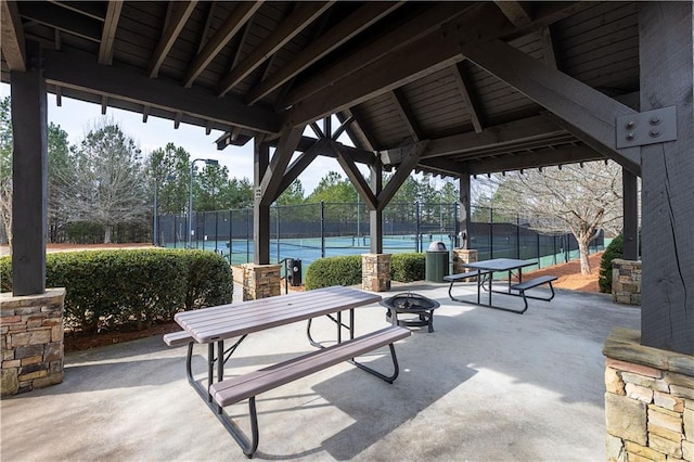 328 Willow Cv, Canton, GA 30114 - view of community featuring a tennis court, fence, an outdoor fire pit, and a patio