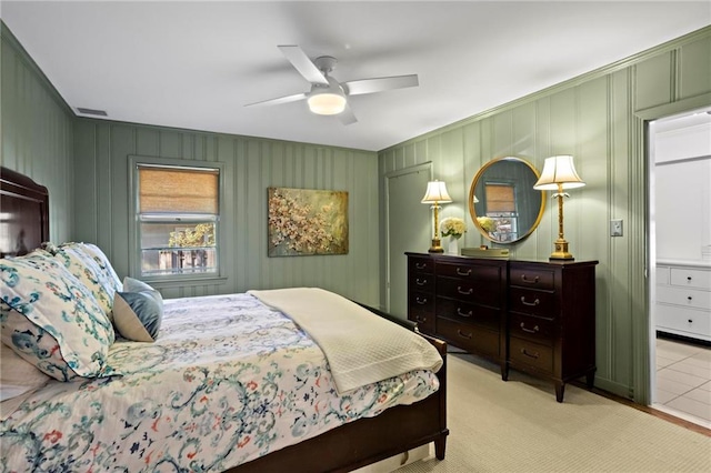 bedroom featuring light carpet and ceiling fan