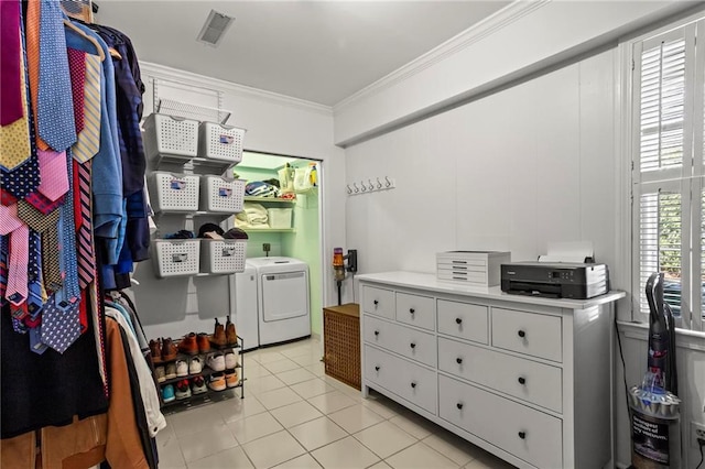 laundry area with light tile patterned floors, laundry area, visible vents, ornamental molding, and washer and clothes dryer