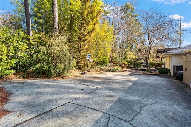 exterior space with concrete driveway