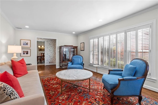 living room with dark wood-type flooring, plenty of natural light, and crown molding