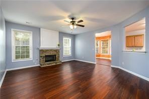 2715 Haynes Club Cir, Grayson, GA 30017 - unfurnished living room featuring a ceiling fan, baseboards, wood finished floors, and a fireplace