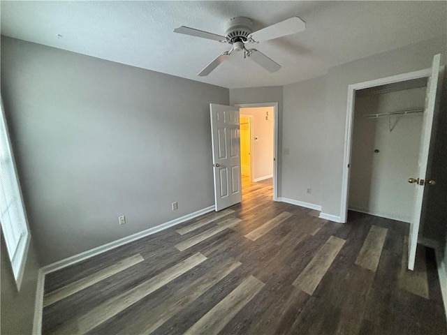 1822 Commonwealth Dr, Woodstock, GA 30188 - unfurnished bedroom with dark wood-style floors, baseboards, a closet, and a ceiling fan