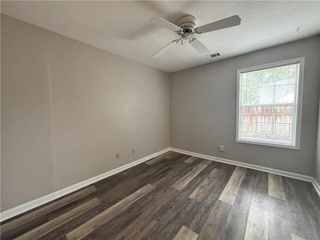 1822 Commonwealth Dr, Woodstock, GA 30188 - unfurnished room with dark wood-style flooring, baseboards, and a ceiling fan