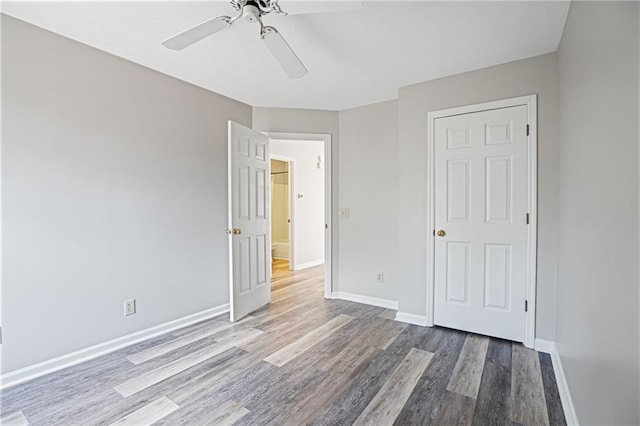 1822 Commonwealth Dr, Woodstock, GA 30188 - unfurnished bedroom featuring wood finished floors and ceiling fan