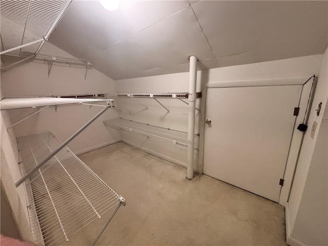 1822 Commonwealth Dr, Woodstock, GA 30188 - walk in closet featuring lofted ceiling and light carpet