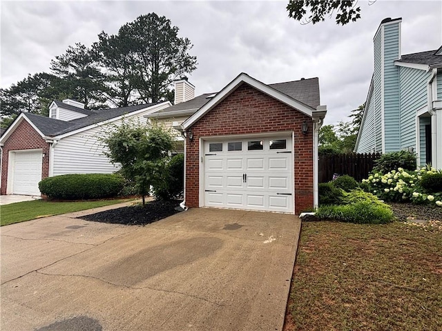 1822 Commonwealth Dr, Woodstock, GA 30188 - view of front of house with brick siding, driveway, and a garage