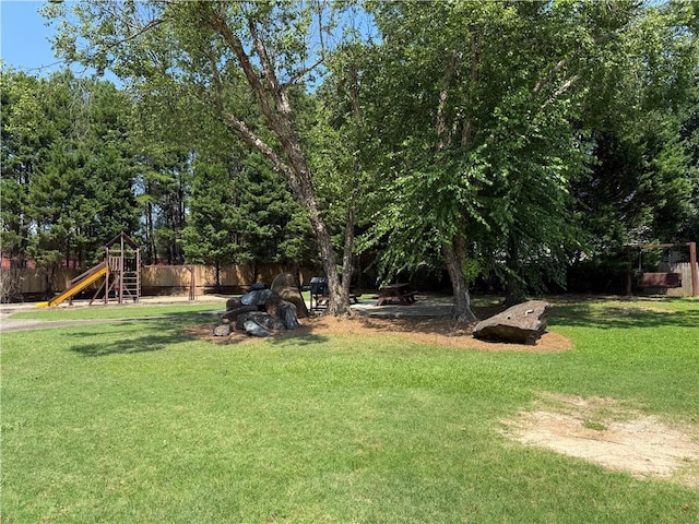 1822 Commonwealth Dr, Woodstock, GA 30188 - view of yard with a playground and view of wooded area