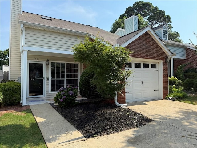 1822 Commonwealth Dr, Woodstock, GA 30188 - view of front facade featuring a chimney, an attached garage, concrete driveway, brick siding, and a shingled roof