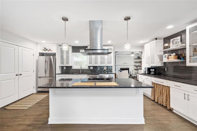 2572 Beverly Hills Dr, Chamblee, GA 30341 - kitchen featuring freestanding refrigerator, island exhaust hood, open shelves, a center island, and decorative backsplash