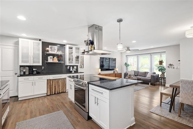 2572 Beverly Hills Dr, Chamblee, GA 30341 - kitchen featuring island exhaust hood, electric range, tasteful backsplash, recessed lighting, and white cabinetry