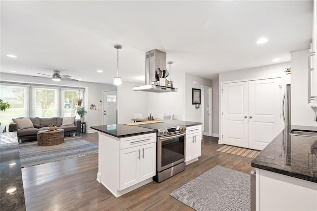 2572 Beverly Hills Dr, Chamblee, GA 30341 - kitchen with stainless steel appliances, ventilation hood, white cabinets, dark wood-style floors, and ceiling fan
