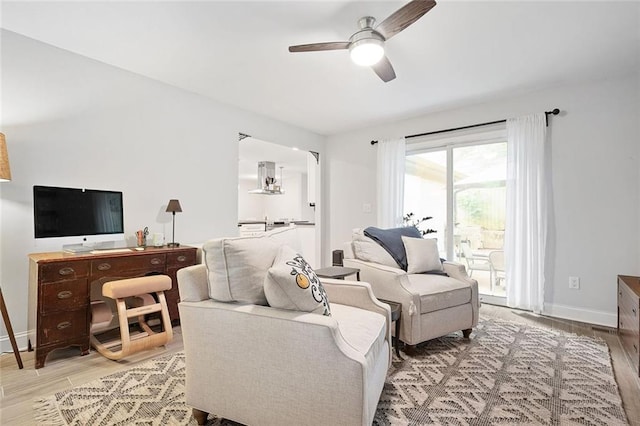 2572 Beverly Hills Dr, Chamblee, GA 30341 - living area with ceiling fan, light wood finished floors, and baseboards