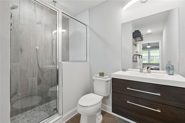 2572 Beverly Hills Dr, Chamblee, GA 30341 - bathroom featuring toilet, a shower stall, vanity, baseboards, and wood finished floors
