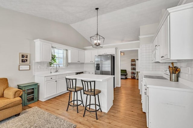 2780 Matlin Way, Buford, GA 30519 - kitchen with white appliances, a kitchen bar, a kitchen island, a sink, and backsplash