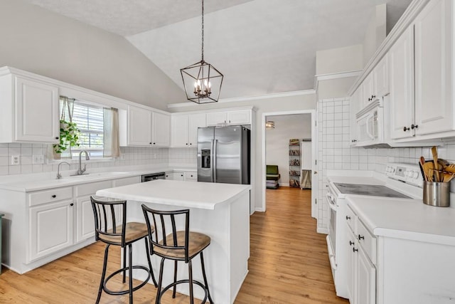 2780 Matlin Way, Buford, GA 30519 - kitchen featuring white appliances, a sink, a kitchen breakfast bar, a kitchen island, and tasteful backsplash