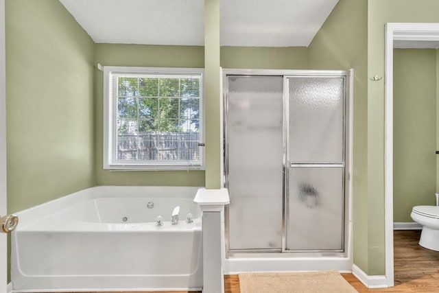 2780 Matlin Way, Buford, GA 30519 - bathroom featuring a shower stall, a jetted tub, toilet, and wood finished floors