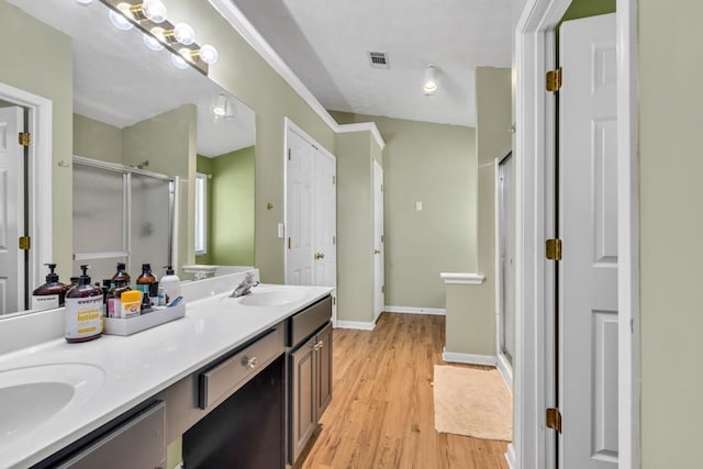 2780 Matlin Way, Buford, GA 30519 - bathroom featuring a shower stall, double vanity, and wood finished floors