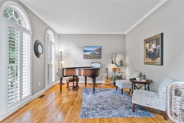 1775 Porterton Way, Cumming, GA 30041 - sitting room featuring plenty of natural light, crown molding, and wood finished floors