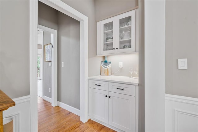 1775 Porterton Way, Cumming, GA 30041 - indoor dry bar featuring light wood-style flooring