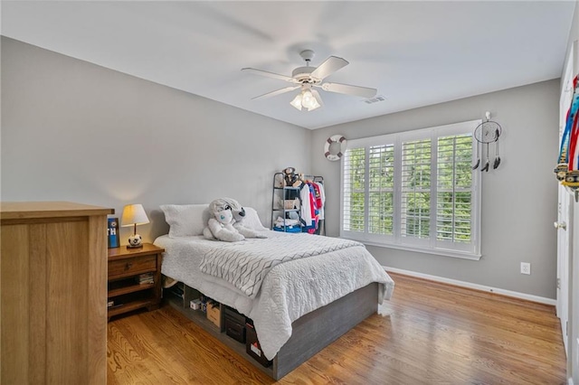 1775 Porterton Way, Cumming, GA 30041 - bedroom with wood finished floors and ceiling fan