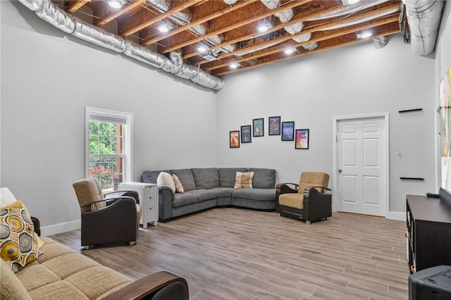 1775 Porterton Way, Cumming, GA 30041 - living room featuring light wood finished floors and a towering ceiling