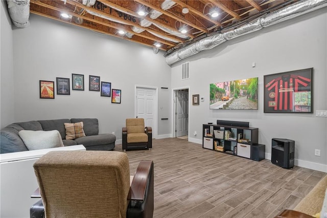 1775 Porterton Way, Cumming, GA 30041 - living room featuring a high ceiling and wood finished floors