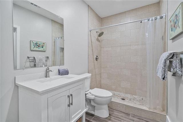 1775 Porterton Way, Cumming, GA 30041 - bathroom with vanity, wood finished floors, and a tile shower