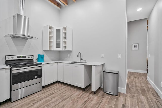 1775 Porterton Way, Cumming, GA 30041 - kitchen featuring stainless steel electric range oven, exhaust hood, light wood finished floors, light countertops, and white cabinetry