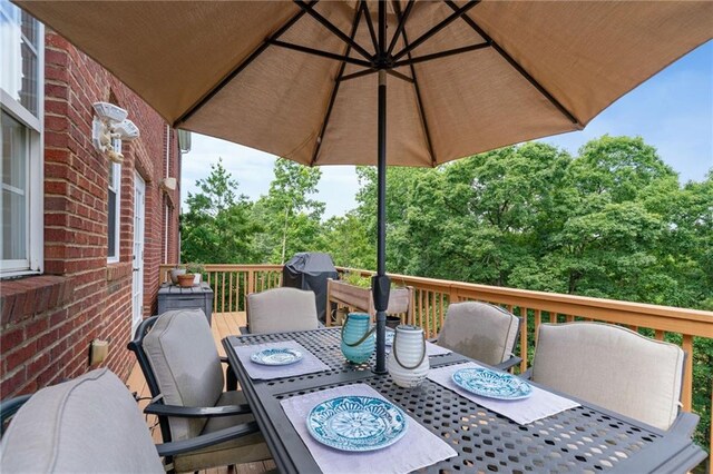 1775 Porterton Way, Cumming, GA 30041 - wooden terrace featuring outdoor dining space and a grill