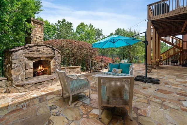 1775 Porterton Way, Cumming, GA 30041 - view of patio featuring stairs, an outdoor living space with a fireplace, and a deck