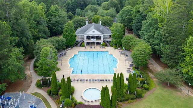 1775 Porterton Way, Cumming, GA 30041 - aerial view of property and surrounding area featuring a pool area and a forest