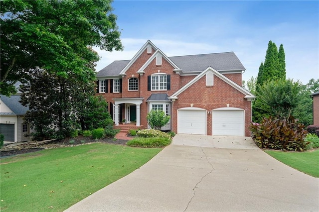 1775 Porterton Way, Cumming, GA 30041 - view of front of house featuring brick siding, concrete driveway, and a front yard